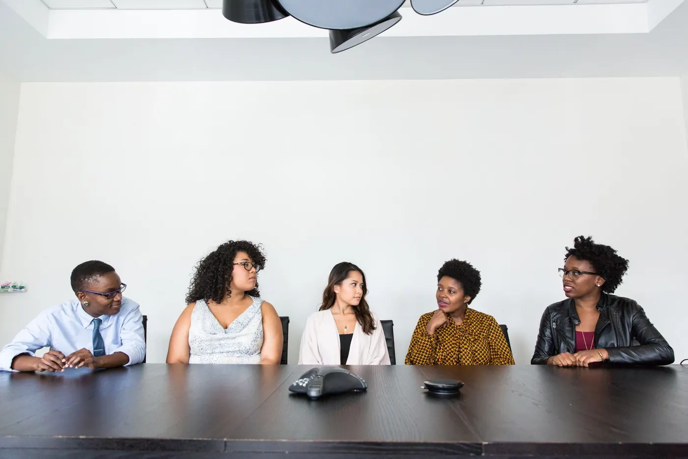 A team reviewing a project plan together in a meeting room